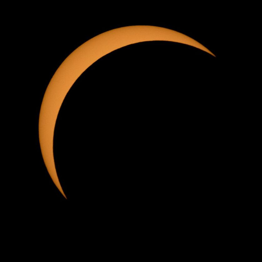 The moon is seen passing in front of the Sun during Monday’s solar eclipse in Ross Lake, Northern Cascades National Park, Washington. | Bill Ingalls/NASA via Getty Images