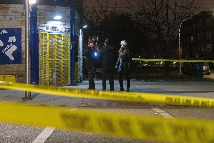 Chicago police investigate a scene where three people where wounded in a shooting Friday night in the 3400 block of West Ohio Street. | Tyler LaRiviere/Sun-Times