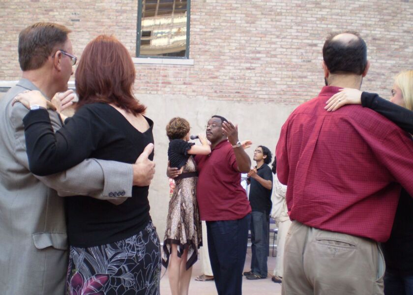 Leroy Hearon (center, in maroon shirt) with tango instructor Nina Tatarowicz.