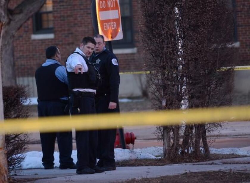 Chicago Police work the scene where two people were shot at 73rd and Hermitage on Monday afternoon. | Brian Jackson / for the Sun-Times