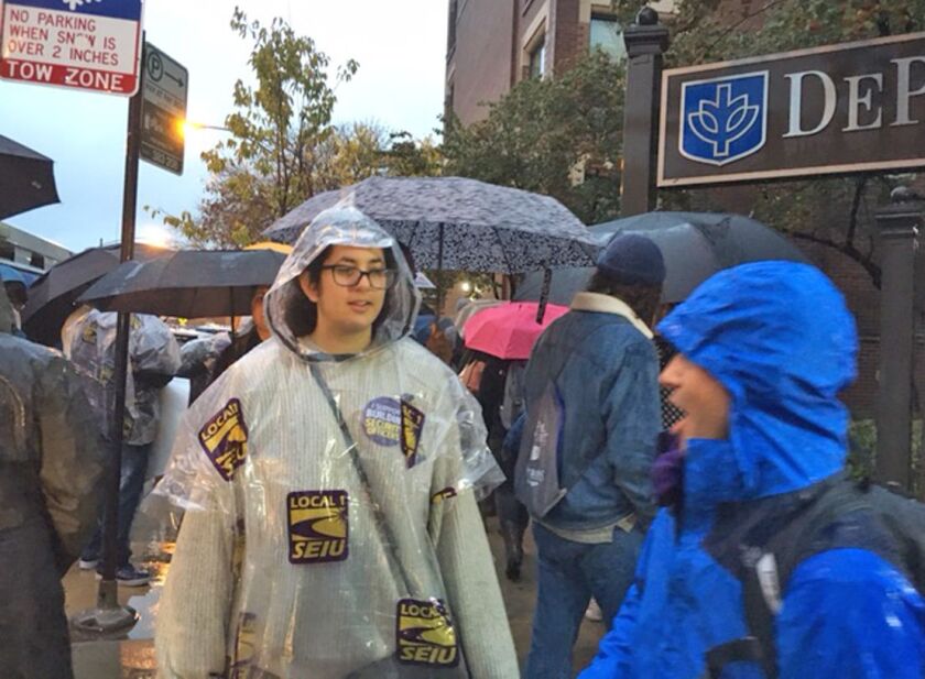 About 100 people gathered at DePaul University on a rainy Tuesday morning, urging the university to fire its private security firm. They say the guards are not being treated fairly by the company, Guardian Security. The company had no comment. | Stefano E