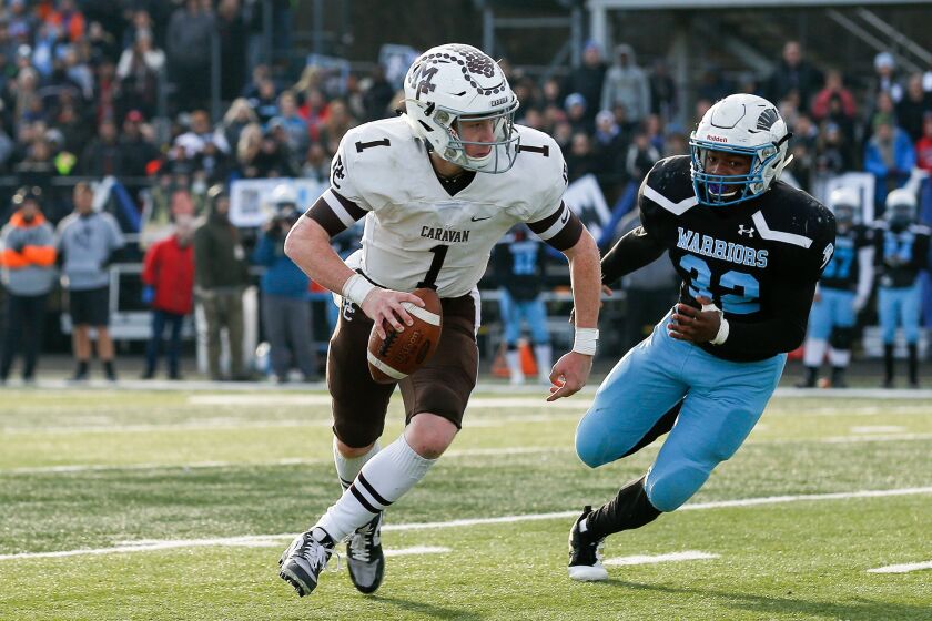 Mount Carmel’s Justin Lynch (1), a Temple recruit, runs the ball against Willowbrook.