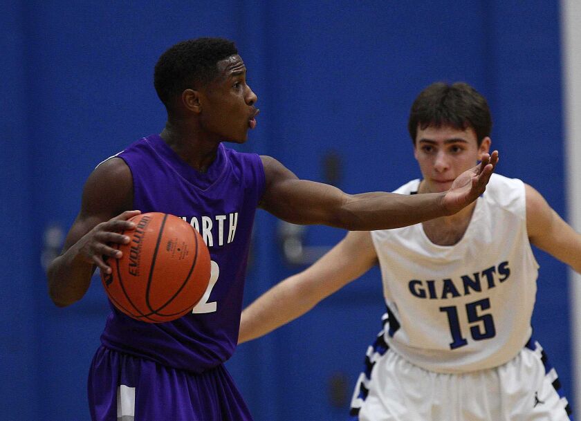 Malachi Nix of Niles North tries to direct traffic during game against Highland Park.