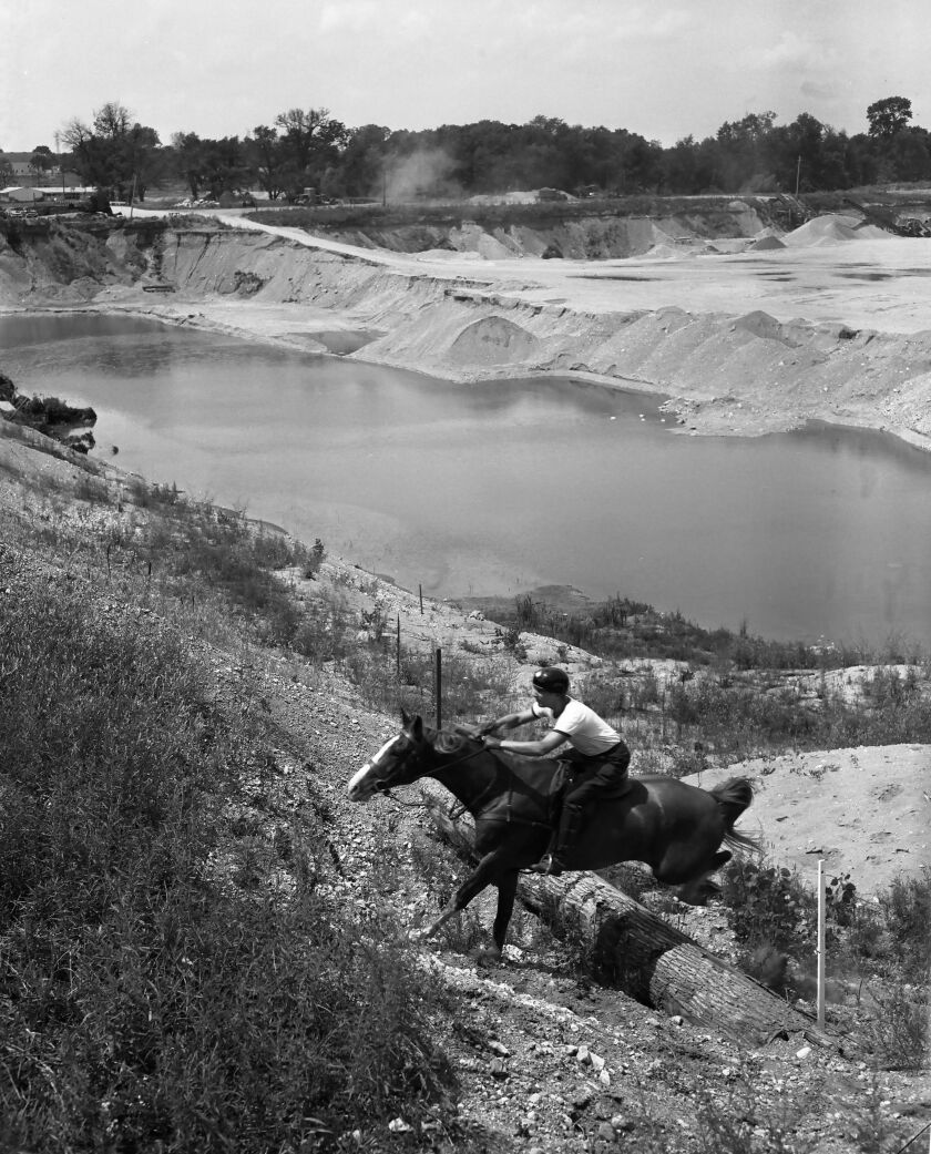 Riders take on the challenge of a gravel quarry just north of Libertyville in the Pan American Games modern pentathlon. Twenty-five countries sent 2,200 athletes to Chicago. Photo taken by Bob Kotalik of the Sun-Times 