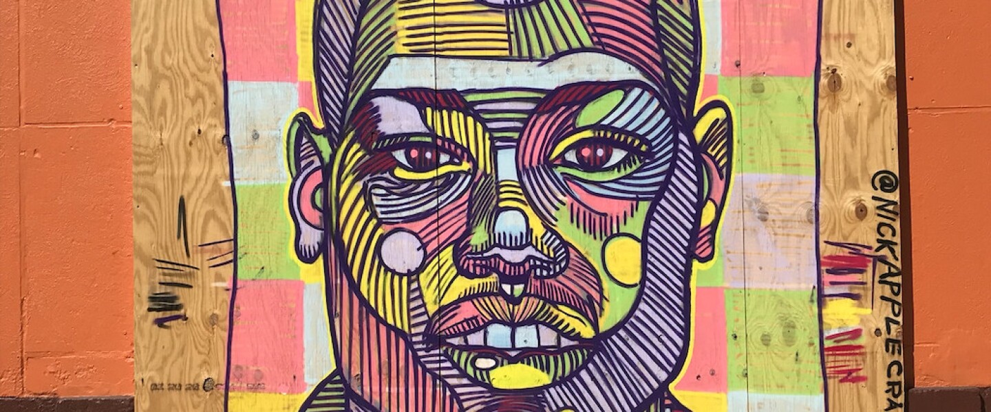 A street artist who goes by the name “Nick Apple,” 30, from Logan Square, painted a portrait outside Papa Cenar in Wicker Park of Ahmaud Arbery, who was killed while jogging in Georgia in February. Apple also has done other images in the same area of George Floyd and Breonna Taylor, who were killed by police, and Oluwatoyin Salau, killed in Florida.