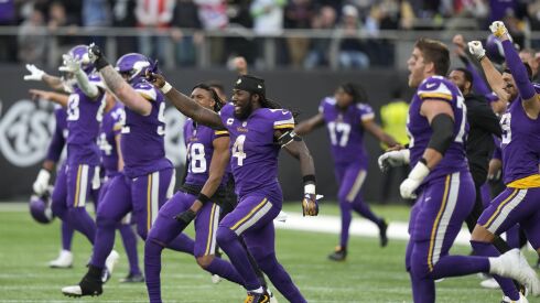 Vikings players celebrate after their victory over the Saints on Sunday.