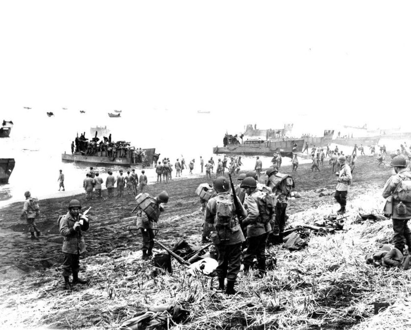 FILE – In this May 26, 1943 file photo released by the U.S. Navy, American soldiers and equipment land on the black volcanic beach during World War II at Massacre Bay on Attu Island, part of the Aleutian Islands of Alaska. (U.S. Navy via AP, File)