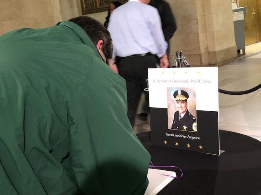 Well-wishers could sign a book at City Hall to offer their condolences to the family of CPD Cmdr. Paul Bauer, who was killed in the line of duty on Tuesday. | Fran Spielman/Sun-Times