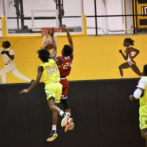 Curie’s Justin Harmon (24) gets a dunk. Worsom Robinson/For the Sun-Times.