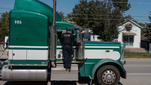 Joe Baez, a truck enforcement officer for the Manhattan police department, after pulling over a semi-truck that was loner than allowed.. The Will County town, used to be mostly farmland but in recent years has seen warehouses develop nearby. An intermodal facility in neighboring Elwood, called CenterPoint, has led semi-trucks to use farm roads and neighborhood streets through Manhattan as a shortcut even though that's illegal. Many drivers consider the fines worth paying to avoid congestion on other routes.