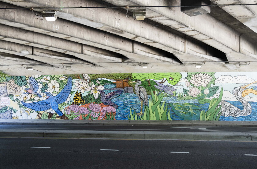 “Day into Night: Lincoln Park’s Living Canvas” is two 100-foot murals on either side of an underpass that connects Lincoln Park to North Avenue Beach.