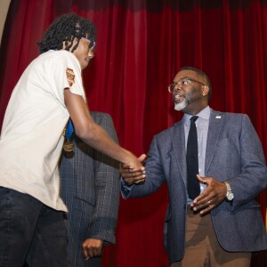 Chicago Mayor Brandon Johnson greets a member of the Marshall Commandos during a celebration for them at John Marshall Metropolitan High School in East Garfield Park, Thursday, April 2, 2026. The team won the won the Illinois High School Association Class 1A state championship in March.