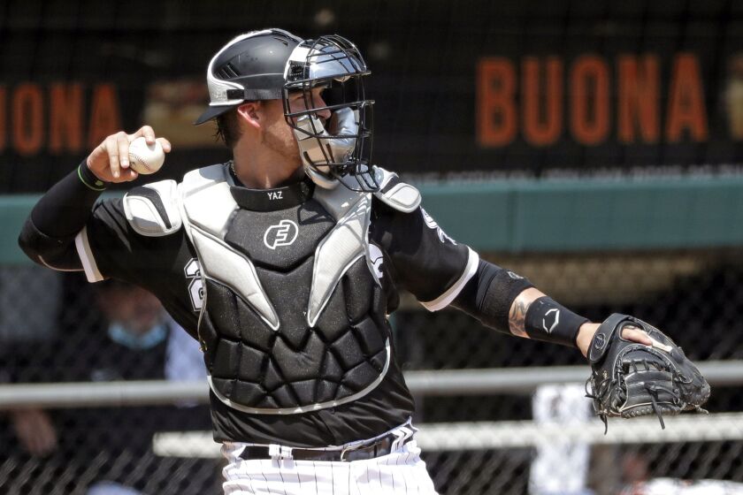 White Sox catcher Yasmani Grandal throws during practice at Guaranteed Rate Field.