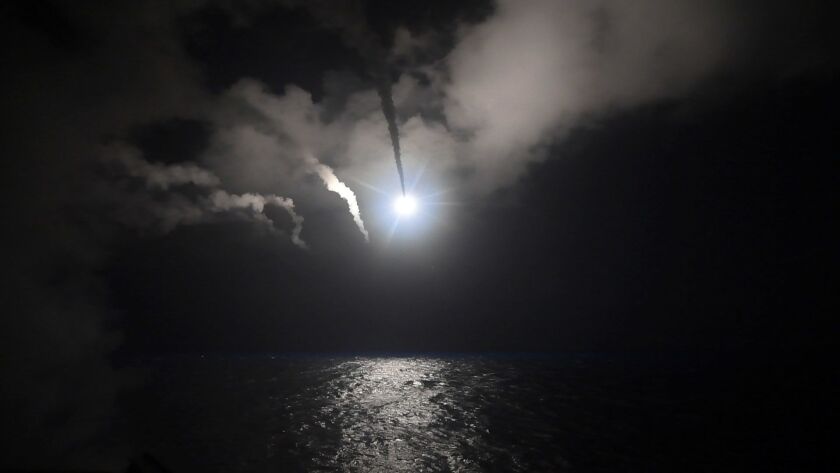 In this image provided by the U.S. Navy, the guided-missile destroyer USS Porter launches a Tomahawk cruise missile in the Mediterranean Sea on Friday. The United States blasted a Syrian air base with a barrage of cruise missiles in fiery retaliation for