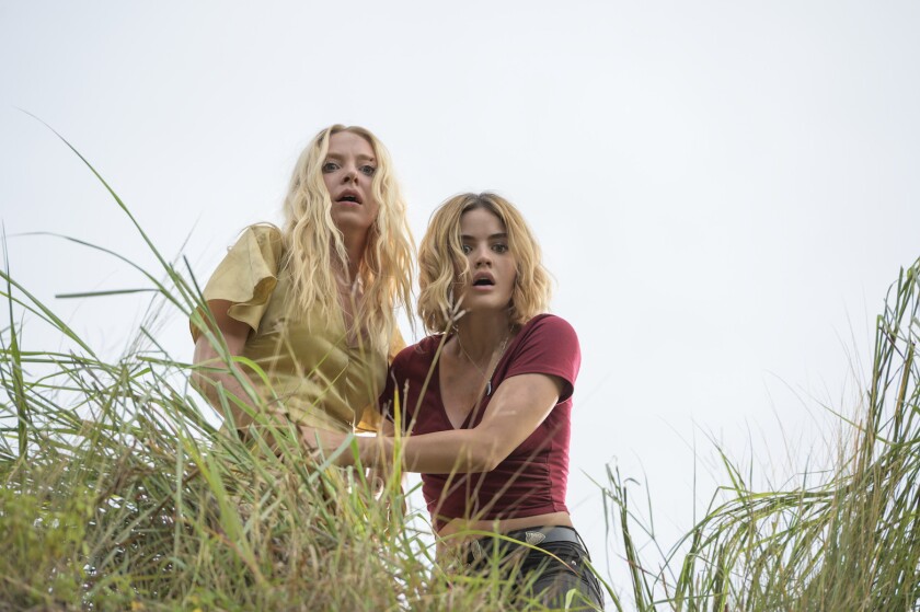 Portia Doubleday (left) and Lucy Hale star as two contest winners who get more than they bargained for when they arrive at a mysterious tropical paradise in Blumhouse’s “Fantasy Island.”