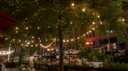 String lights decorate trees and outdoor dining areas along West Fulton Street.