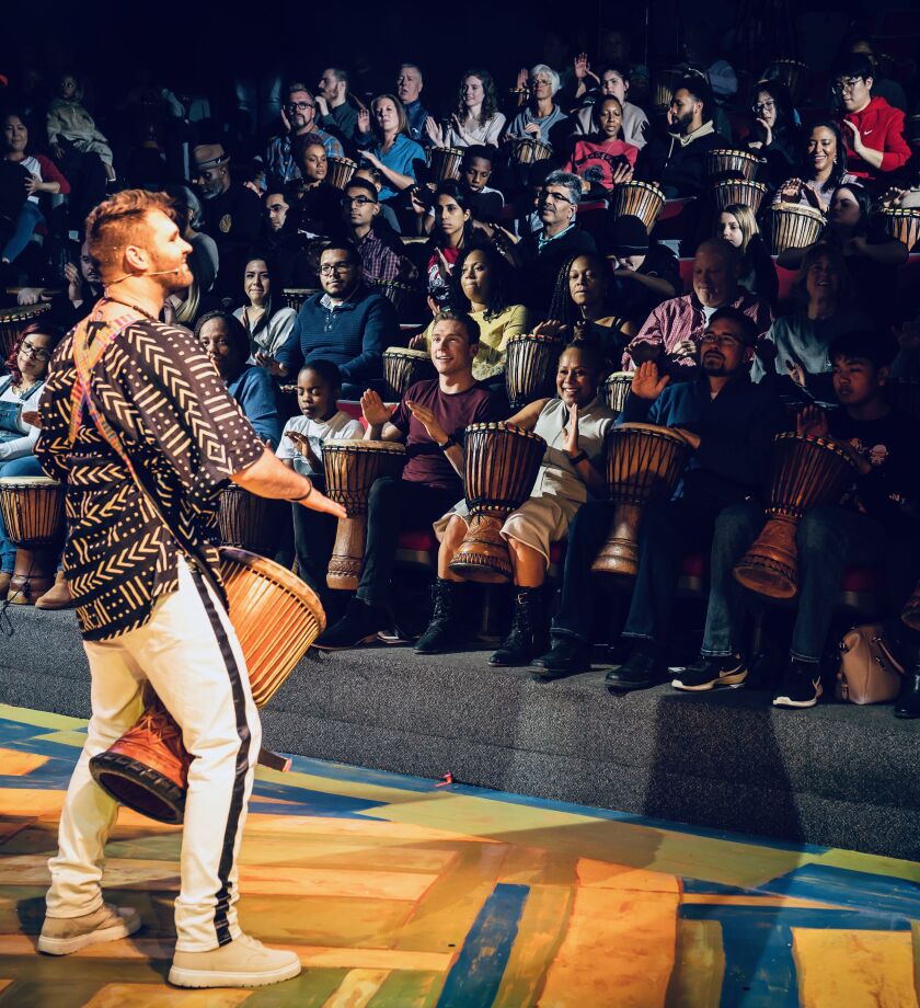 Ben Hope gets the audience to participate in the drumming fun during “DJEMBE! The Show.” | Liz Lauren Photo