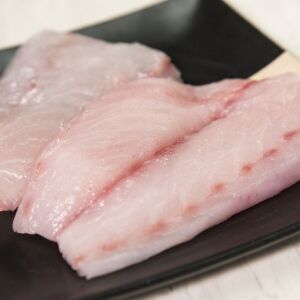 Striped sea bass before it’s seasoned with salt and pepper. | Ashlee Rezin/Sun-Times