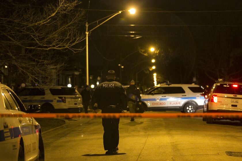 Chicago Police investigate in the 9500 block of South Calumet early Thursday, Dec. 7, 2017. An officer was shot in the hand during a foot pursuit Wednesday night, and taken in good condition to Christ Medical Center in Oak Lawn. | Ashlee Rezin/Sun-Times