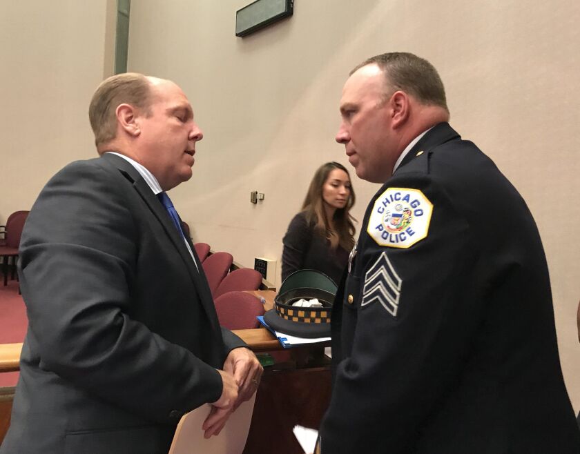 Sgt. Keith Blair, commanding officer of the Chicago Police Department’s Major Auto Theft Investigative Unit, (right) shown with Ald. Harry Osterman (48th) after Tuesday’s meeting of the City Council’s Public Safety Committee, said stealing from some car l