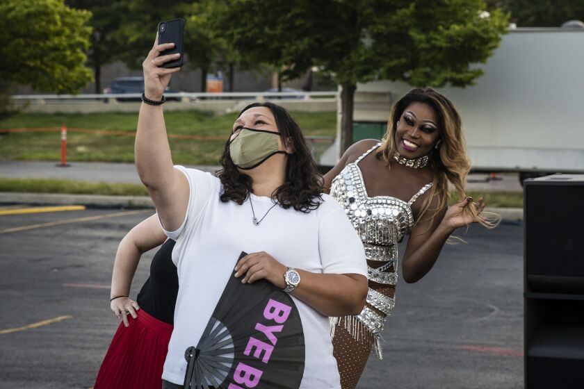 Asia O’Hara takes a socially-distant selfie with fans during Drive ‘N Drag presented by Voss Events at Soldier Field, Friday night, Aug. 7, 2020.