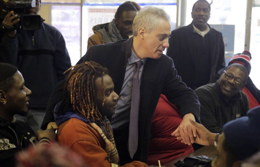 Chicago Mayor Rahm Emanuel joins phone bank workers on election day Tuesday, Feb. 24, 2015, in Chicago. (AP Photo/M. Spencer Green)