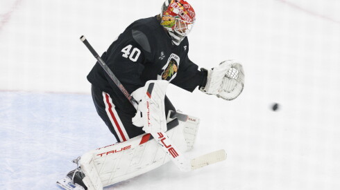 Chicago Blackhawks goaltender Arvid Soderblom (40) tries to catch a puck during training camp at the Blackhawks Ice Center.