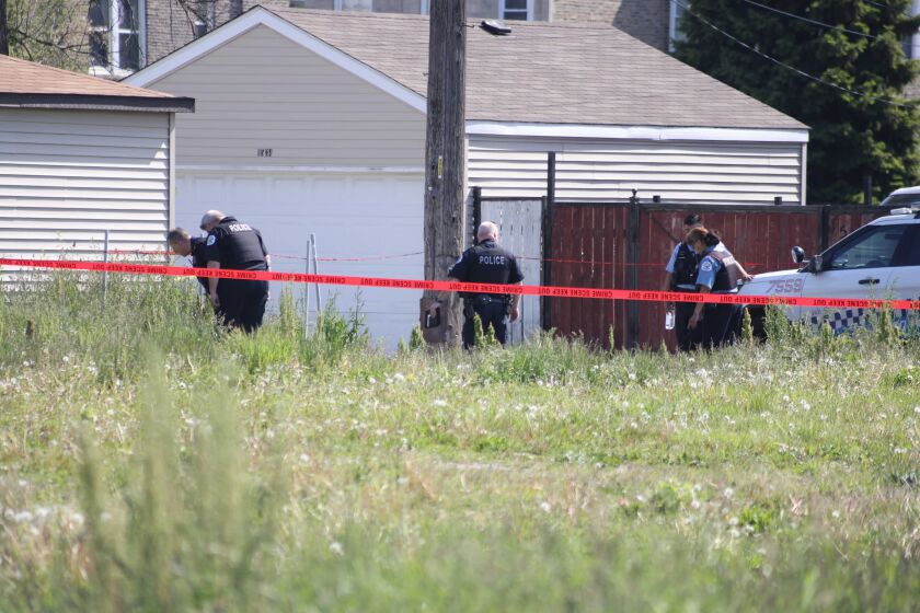 Chicago police investigate the scene where two officers were shot May 16, 2021, in Lawndale.