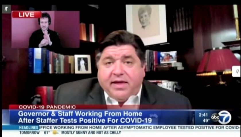 Gov. J.B. Pritzker delivers his daily briefing from his Gold Coast home on Monday.