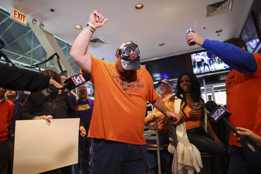 Matt Butkus, son of Dick Butkus, raises his fist in memory of his dad at a bears tailgate in honor of former Bears linebacker Dick Butkus at Billy Goat Tavern at Navy Pier, Sunday, October 15, 2023. Family, friends and Bears fans celebrated the life of former Bears Linebacker Dick Butkus who died October 5, 2023 at the age of 80. | Anthony Vazquez/Sun-Times
