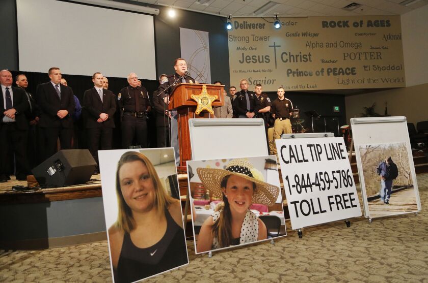 Capt. David Bursten of the Indiana State Police and other law enforcement officials are shown at an earlier briefing on the murders of Liberty German, 14, and Abigail Williams, 13. The two Delphi, Ind. girls were killed while hiking the High Bridge Trail