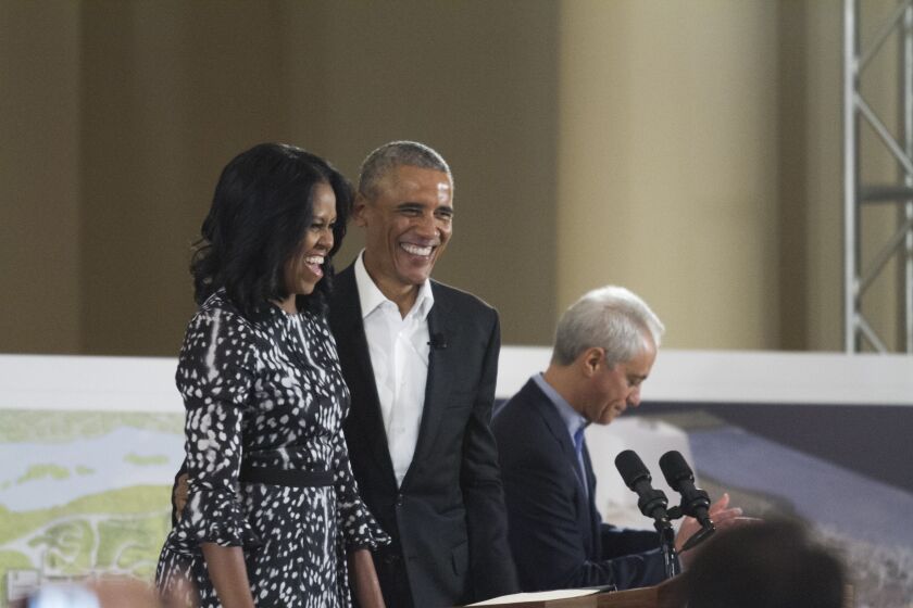 Michelle and Barack Obama appeared Wednesday at the South Shore Cultural Center, along with Chicago Mayor Rahm Emanuel (right). | Maria Cardona/Sun-Times