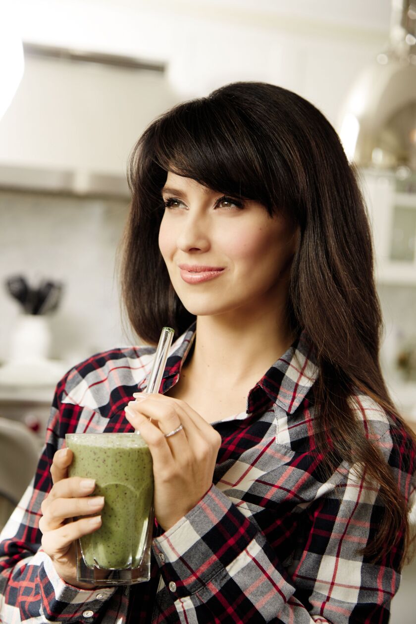 Hilaria Baldwin enjoys a kale, blueberry, mango and almond butter smoothie, created from one of the recipes featured in her new book “The Living Clearly Method: 5 Principles for a Fit Body, Healthy Mind & Joyful Life.” | COPYRIGHT RODALE BOOKS