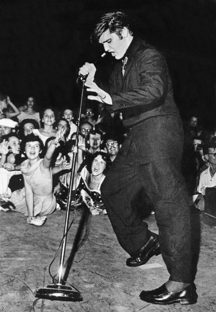 Elvis Presley performs for 14,000 fans at Russwood Park in Memphis the night of July 4, 1956. | Robert Williams / The Commercial Appeal, via AP/FILE