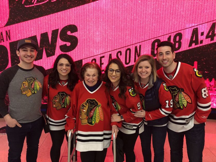 RoseLee Deutsch, wearing her late husband Earl’s Blackhawks jersey at a Hawks game March 8, was accompanied by some of her grandchildren and their significant others.