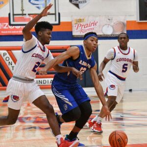 Curie’s Damari Nixon (2) tries to slow down Bloom’s Dante Maddox Jr. (12).