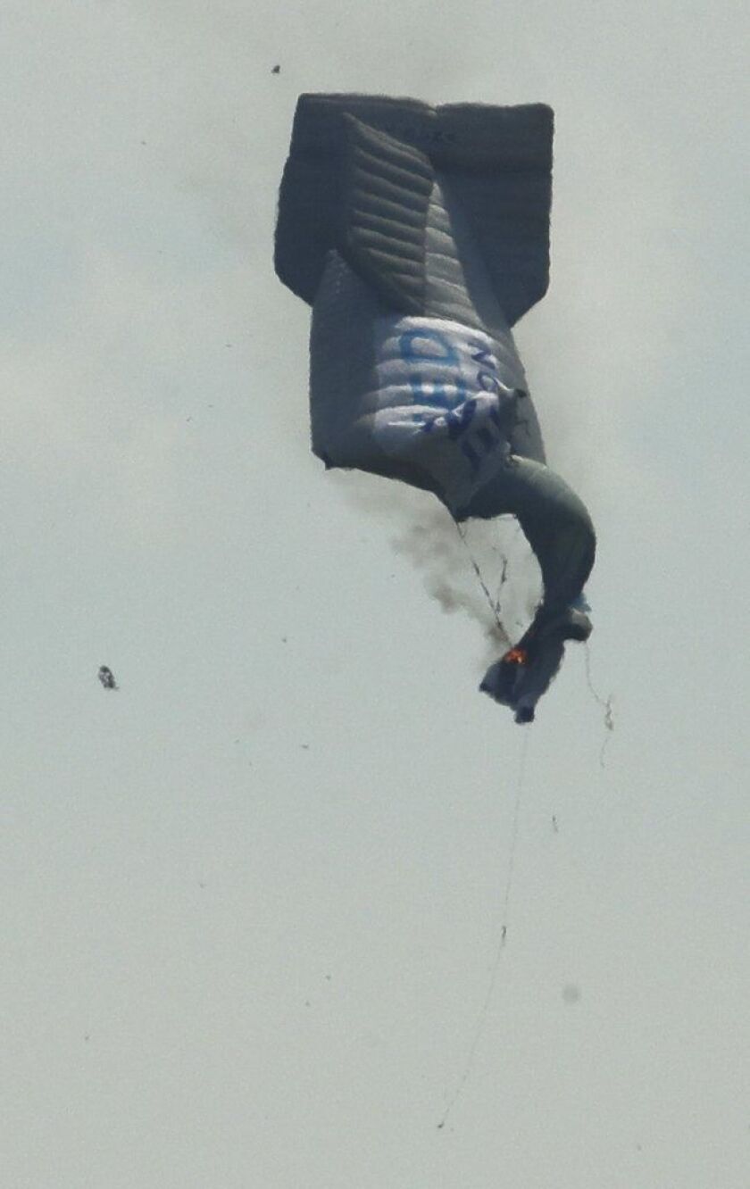 A blimp crashes during the first round of the U.S. Open golf tournament Thursday, June 15, 2017, near Erin Hills in Erin, Wis. AirSign, an advertising company, operates the blimp. Charlie Riedel/Associated Press