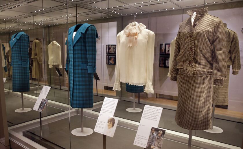 A selection of coats and outfits worn by Diana, Princess of Wales, including at right, a brown tweed wool day suit by Bill Pashley, which she wore on her honeymoon in Scotland 1981. (AP Photo/Alastair Grant)