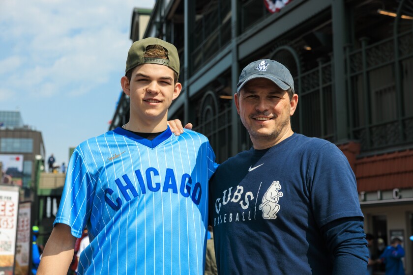Jerry Evans, 54, and Jake Evans, 17, outside Wrigley Field on the Chicago Cub’s opening day on Thursday.