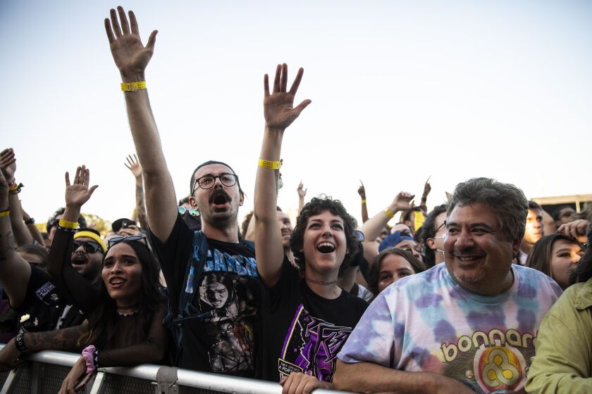 Fans cheer as Gogol Bordello performs on Day 3 of Riot Fest.