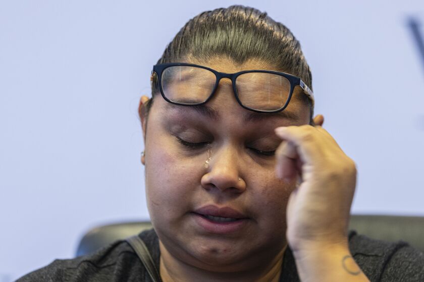Mariana Ochoa, mother of 7-year-old Victor Lobato Ochoa, wipes away tears as she speaks about her son during a press conference to announce the filing of a lawsuit against Material Services Corporation at Wise Morrissey LLC at 161 N. Clark St in the Loop, Thursday, July 1, 2021. 7-year-old Victor Lobato Ochoa drowned on the Chicago river after a wake capsized the boat he was in. | Anthony Vazquez/Sun-Times