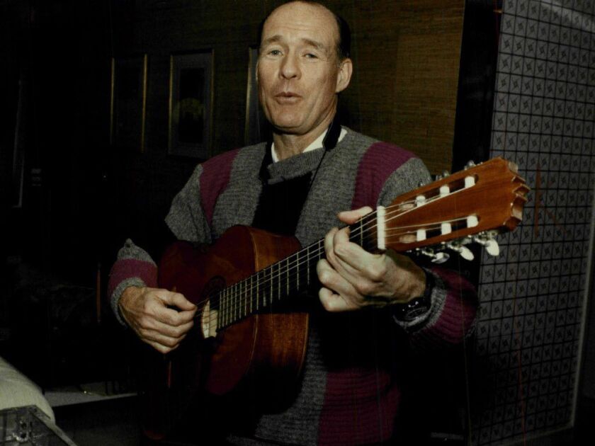Patrick H .Arbor in 1993 with an acoustic guitar he used to play Italian folk tunes. File Photo.