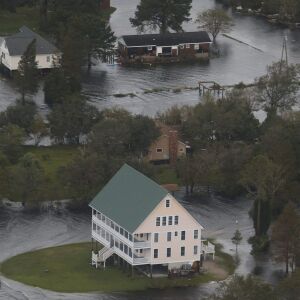 Houses are surrounded by water from Florence, now a tropical storm, in New Bern, NC., Saturday, Sept. 15, 2018. | AP Photo/Steve Helber