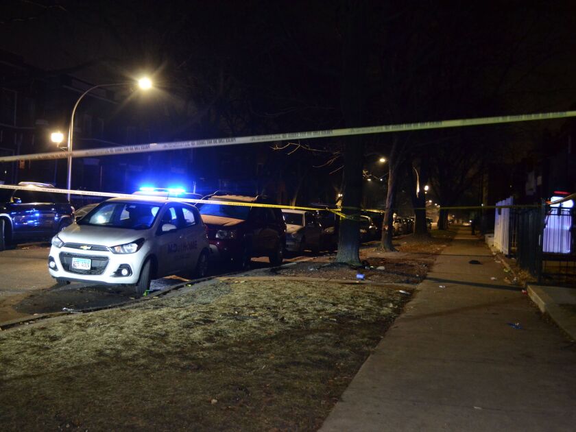 Chicago police investigate the scene where a person was shot Saturday night in the 4700 block of West Gladys, in the West Garfield Park neighborhood. | Justin Jackson/ Sun-Times
