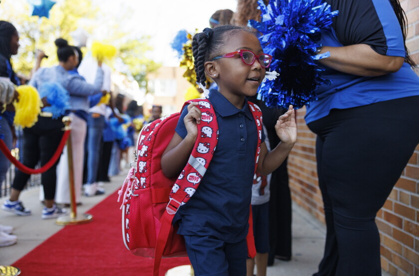 Students walk into school Monday on the first day of class at George Leland Elementary School at 512 S. Lavergne Ave. in Austin.