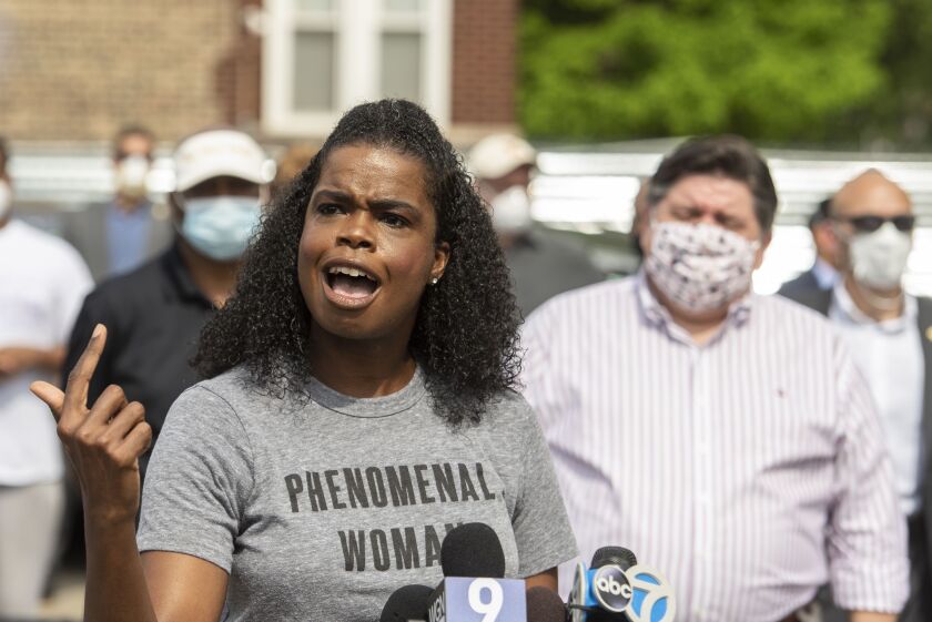Cook County State’s Attorney Kim Foxx speaks to reporters and residents at a day of action rally on the West Side earlier this month.