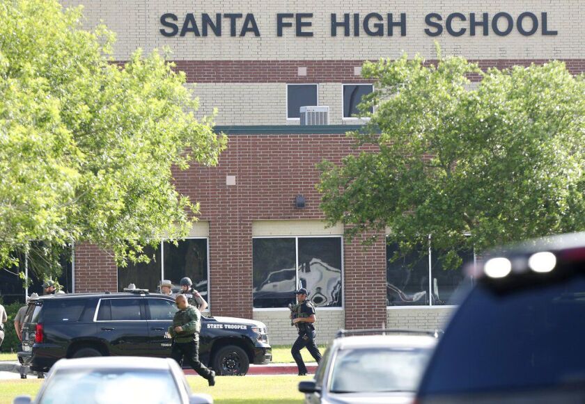 Law enforcement officers respond to Santa Fe High School after an active shooter was reported on campus, Friday, May 18, 2018, in Santa Fe, Texas. ( Steve Gonzales/Houston Chronicle via AP)