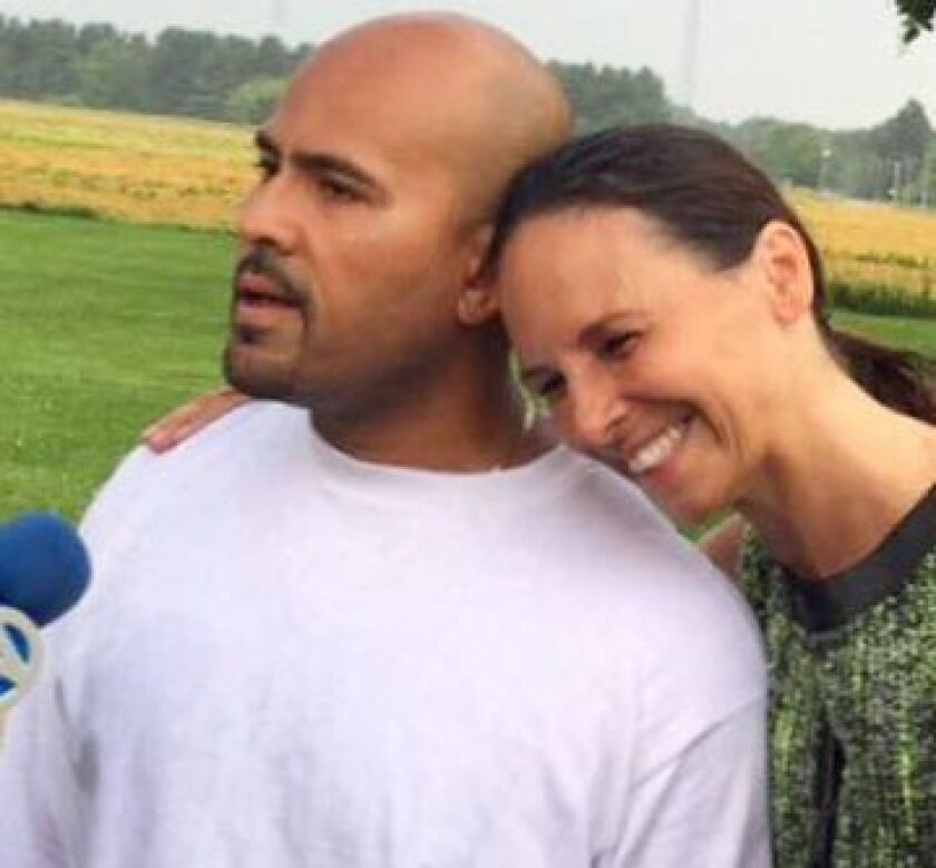 Armando Serrano, left, is embraced by his attorney, Jennifer Bonjean. | Bonjean Law Group photo