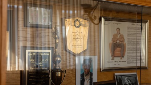 A display case at Leak and Sons Funeral home features awards and memorabilia.