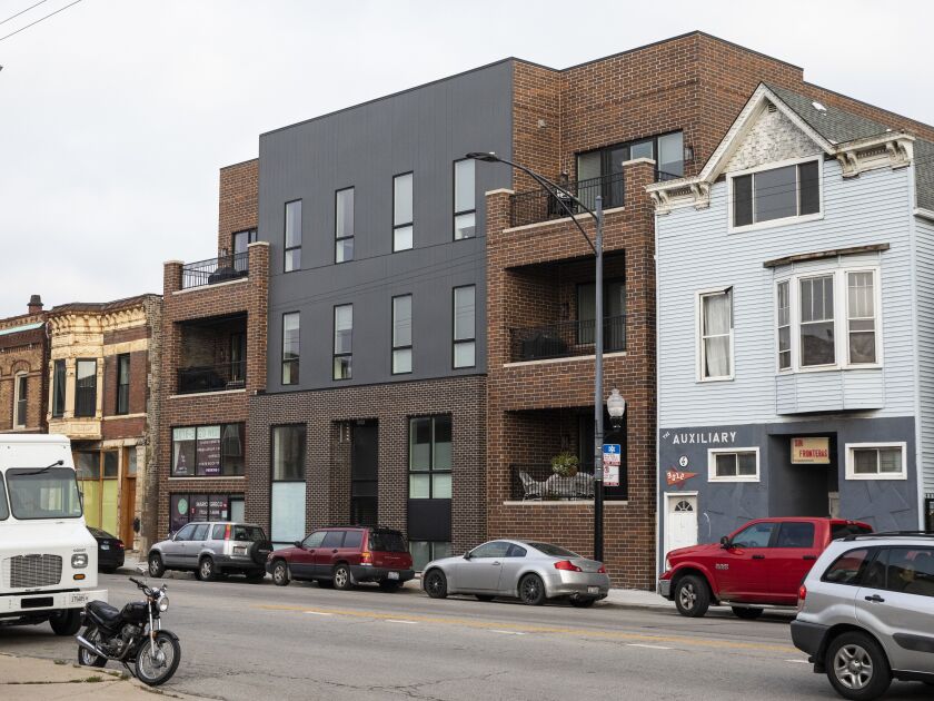 In 2018, construction began on new condos at the place where the Honey Baked Ham once stood at 3018 W. Belmont Ave. The alley is no longer there, but the building with the peaked roof to the right was there in 1993.